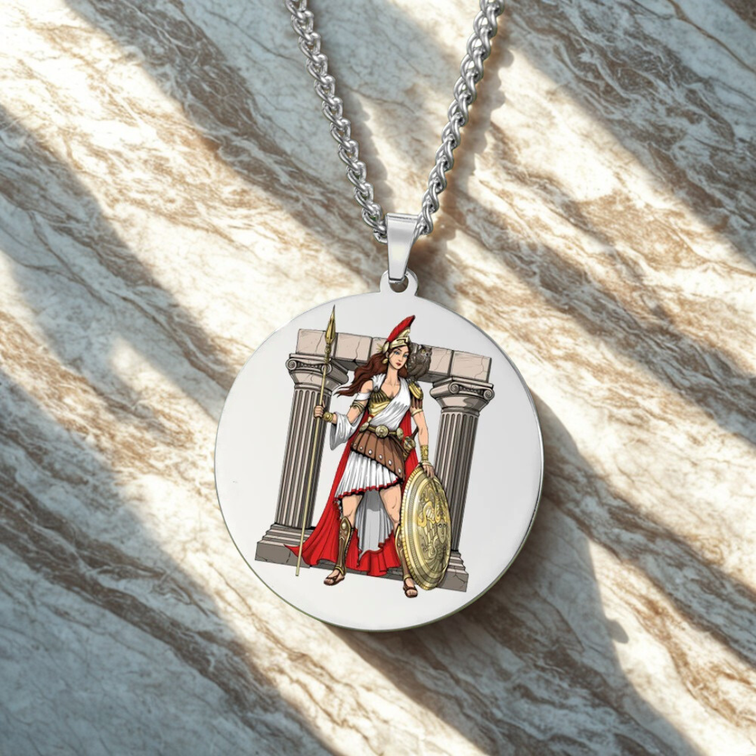 Circular pendant with Goddess Athena design on a marble surface