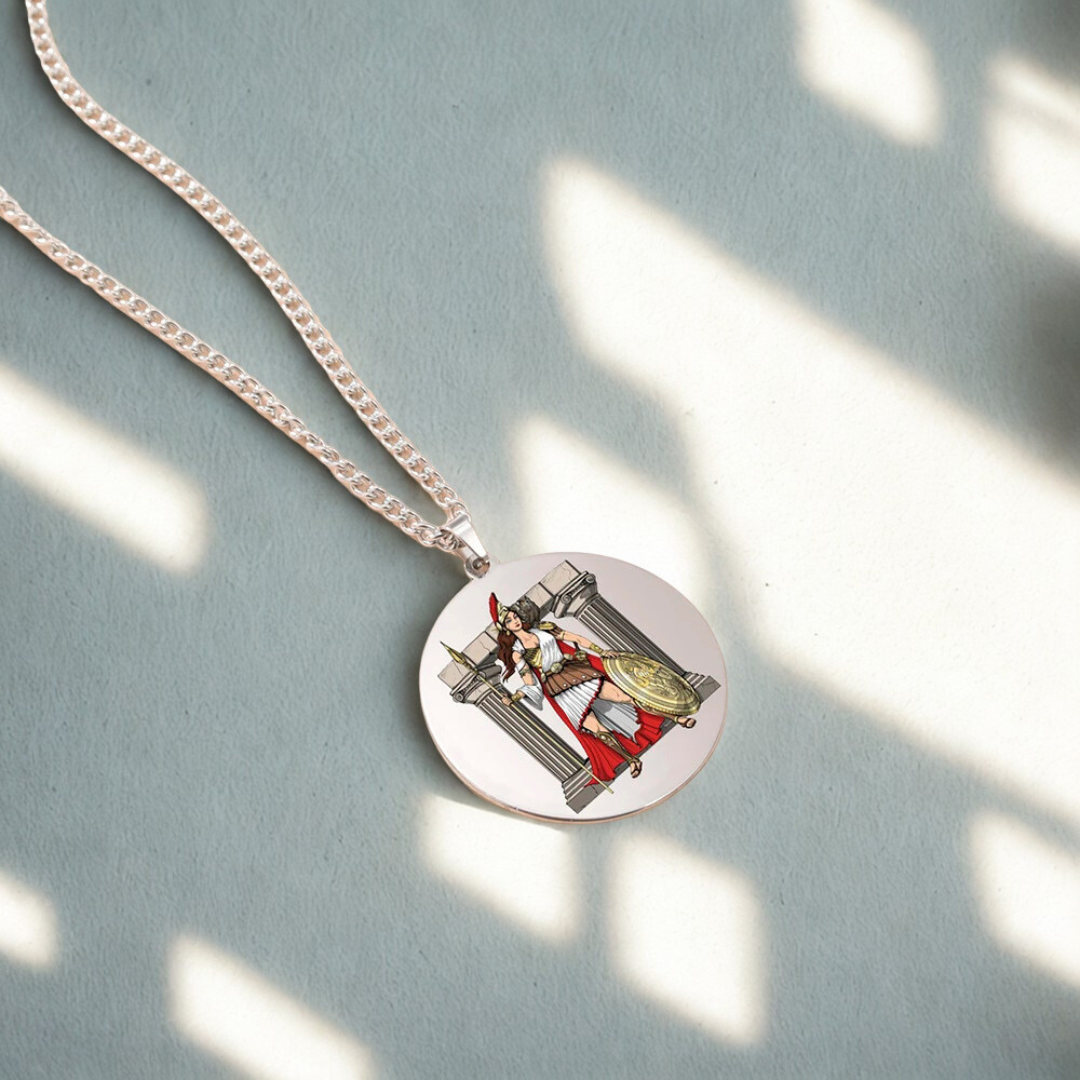 Necklace with a round pendant featuring a Goddess Athena design on a light blue background