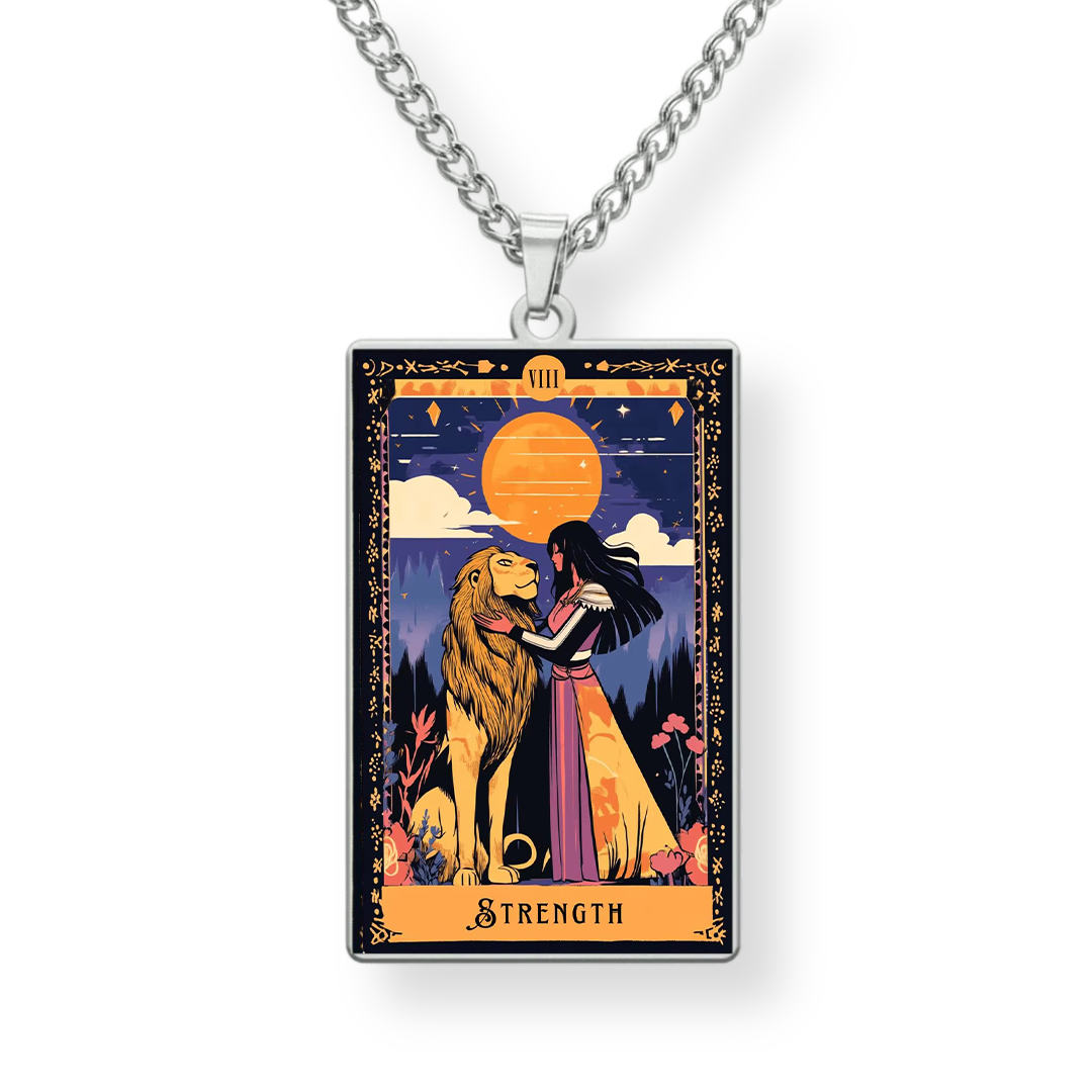 Necklace with a pendant featuring a tarot card design of a woman and lion with 'Strength' text on a white background.
