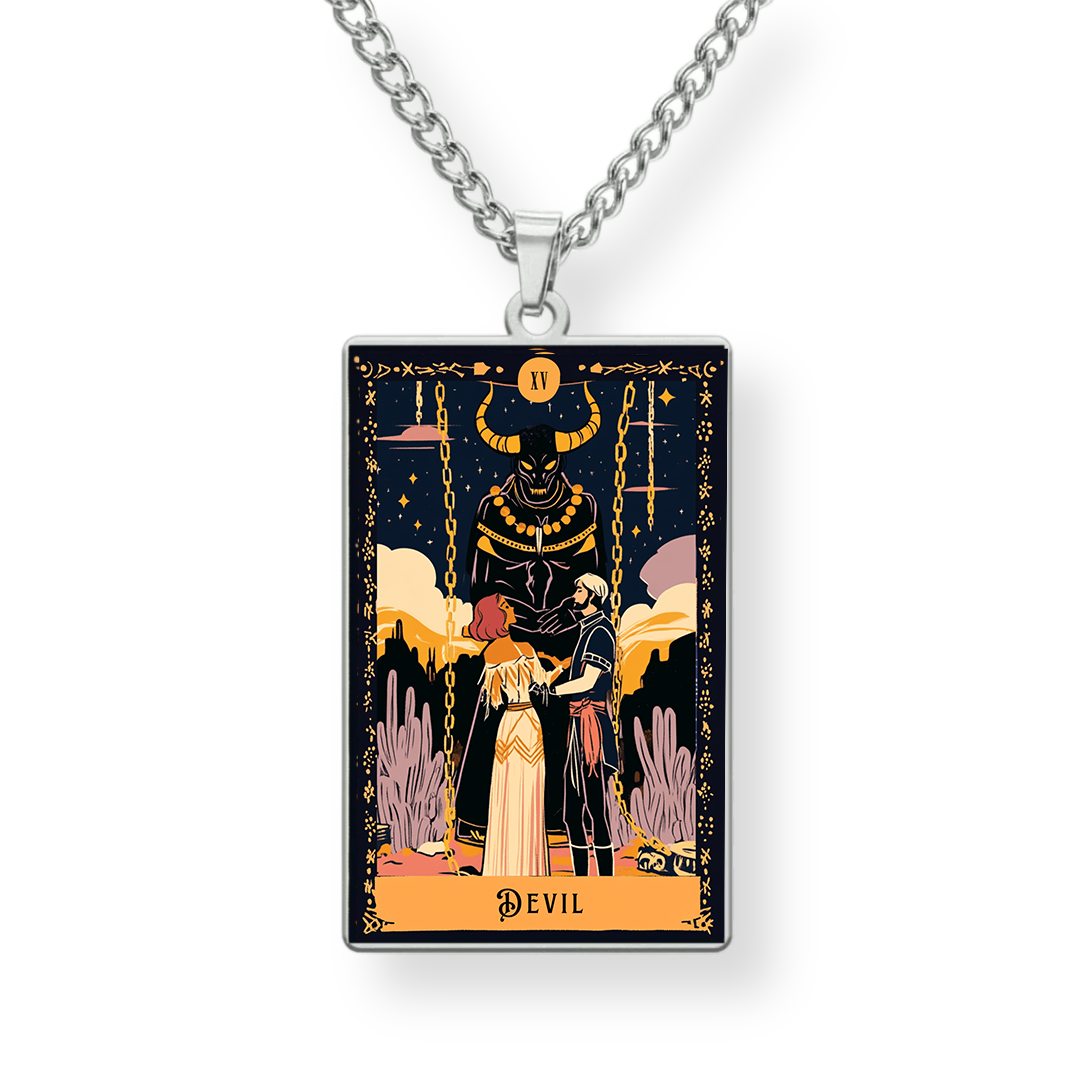 Tarot card design pendant on a chain against a white background
