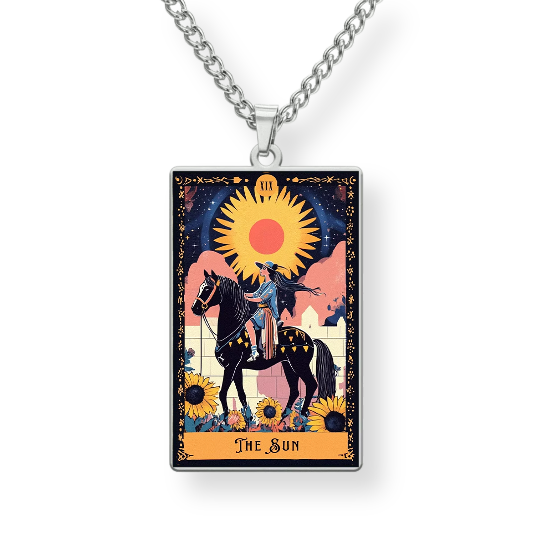 Necklace with pendant featuring 'The Sun' tarot card design on a white background