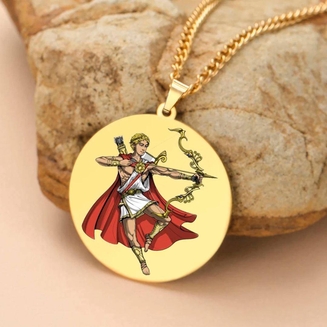 Gold pendant with a Greek God Apollo design on a stone surface