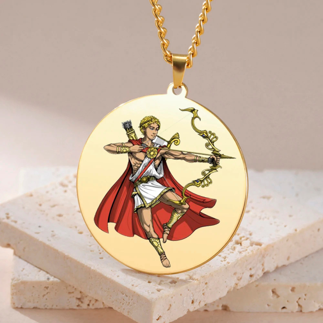 Gold pendant with a depiction of the Greek God Apollo in a red cape on a beige background