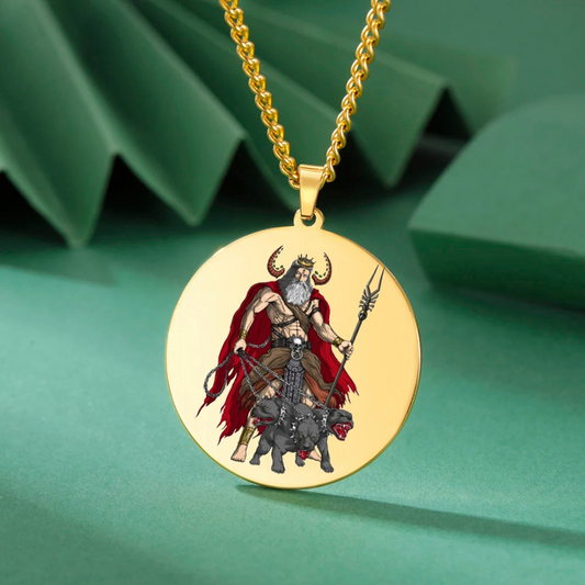 Gold pendant with a Hades & Cerberus design on a green background
