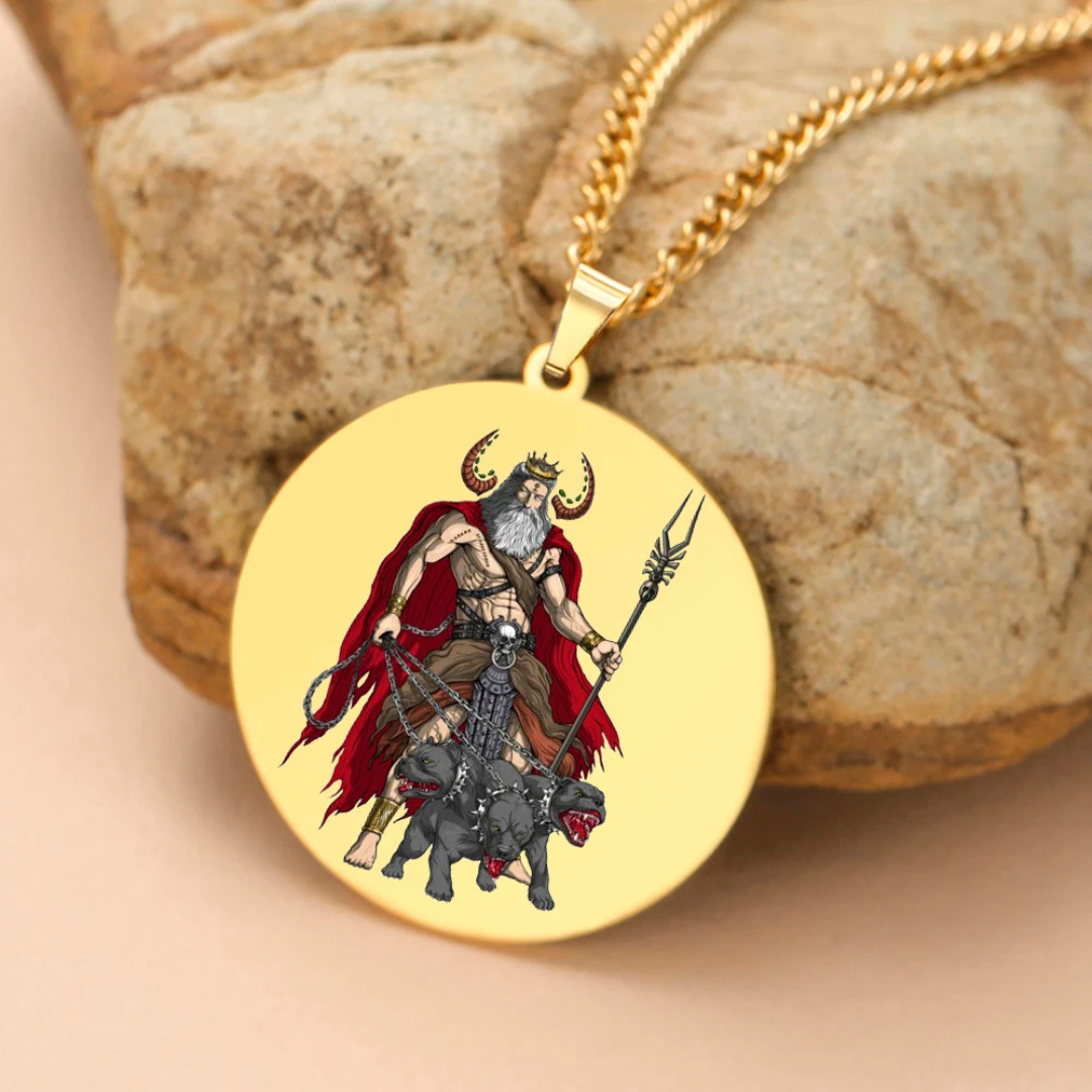 Gold pendant with a Hades & Cerberus design on a stone surface
