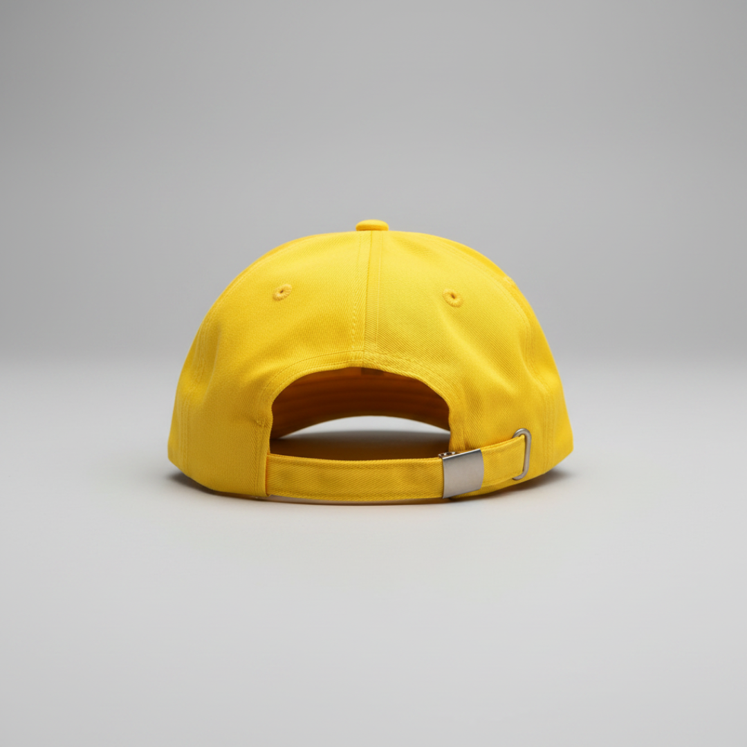 Yellow cap with a metal buckle on a gray background