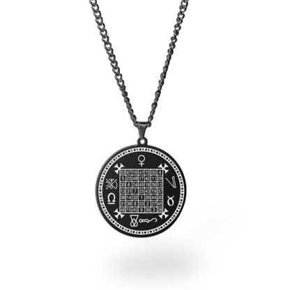 A black circular pendant necklace featuring a occult-style magic square grid and symbols, suspended from a dark metal chain against a white background.