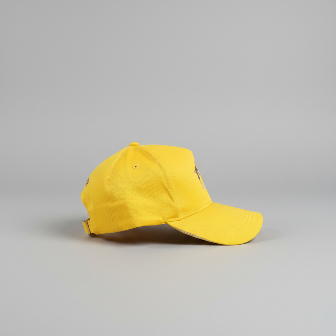 Yellow baseball cap on a gray background