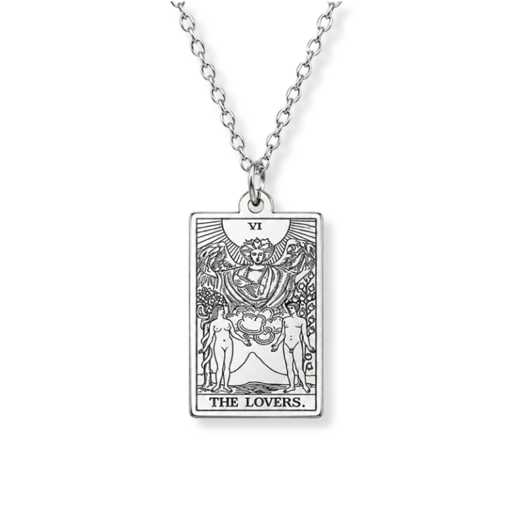 A silver-toned tarot card pendant necklace featuring 'The Lovers' card design, suspended from a matching link chain against a plain white background.