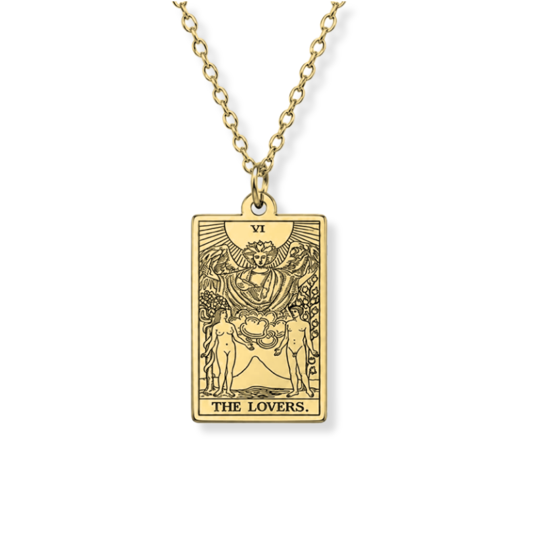 A gold-toned tarot card pendant necklace featuring 'The Lovers' card design, suspended from a matching rose gold chain against a plain white background.