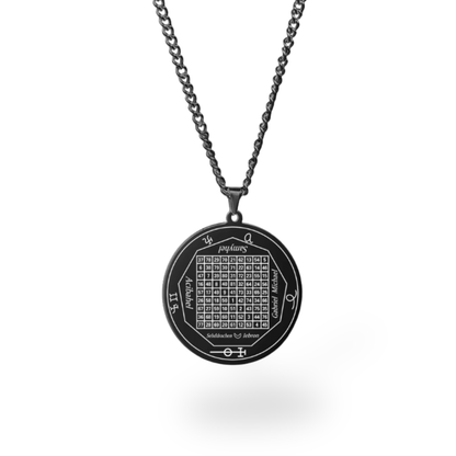 A black metal pendant necklace featuring a circular design with a magic square grid and astrological or symbolic markings, suspended from a matching black chain against a white background.