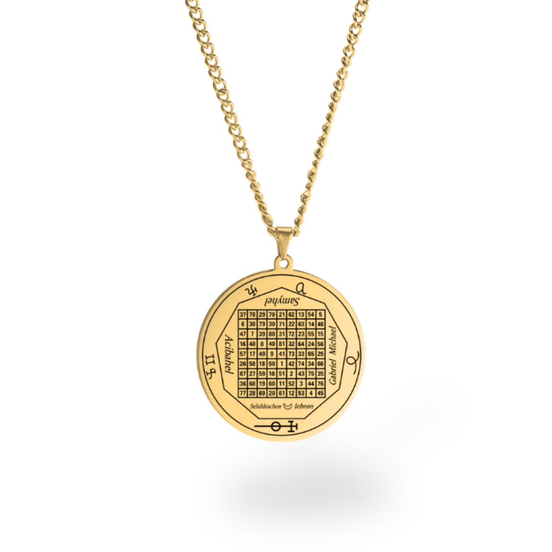 A gold pendant necklace featuring the Kabbalistic Tree of Life or a magic square grid with astrological symbols and Hebrew text, suspended from a gold chain against a white background.
