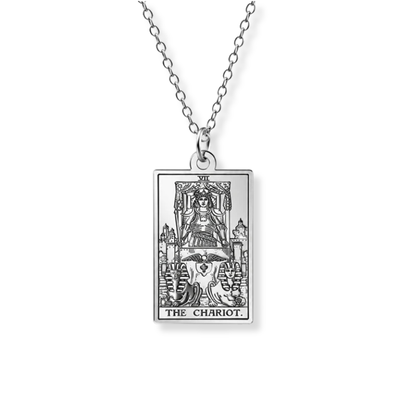 A silver-toned metal necklace featuring a rectangular pendant engraved with the Tarot card 'The Chariot'.