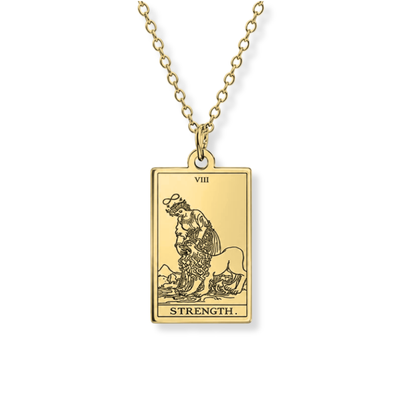 A gold-toned tarot card pendant necklace featuring the 'Strength' card (VIII), suspended from a matching chain against a plain white background.