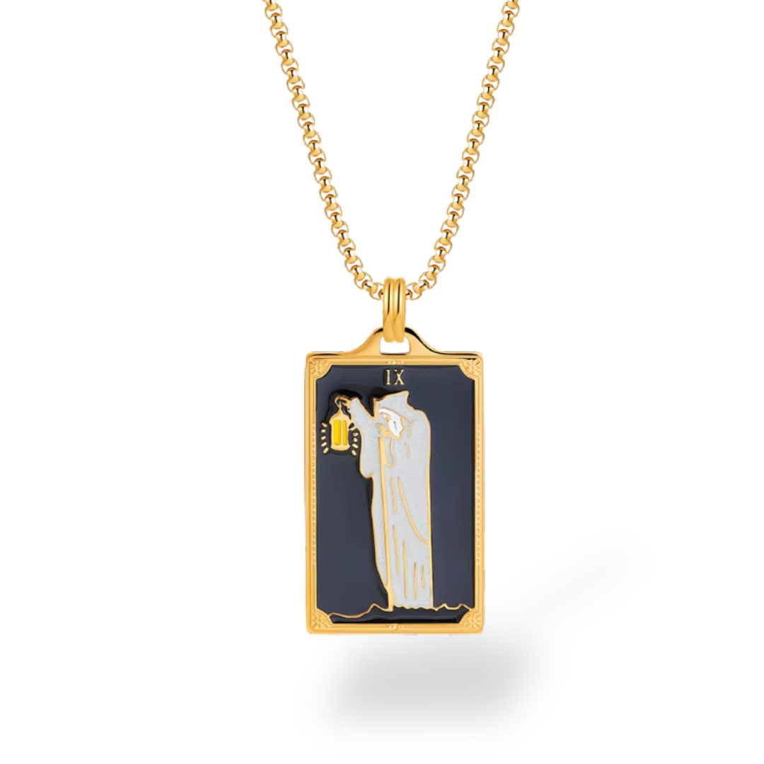 Gold necklace with a rectangular pendant featuring a religious scene on a white background