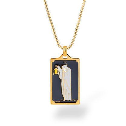 Gold necklace with a rectangular pendant featuring a religious scene on a white background