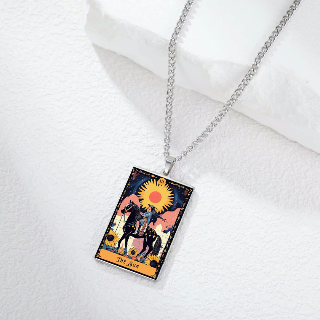 Necklace with a tarot card-style pendant featuring a horse and sun design on a white background.