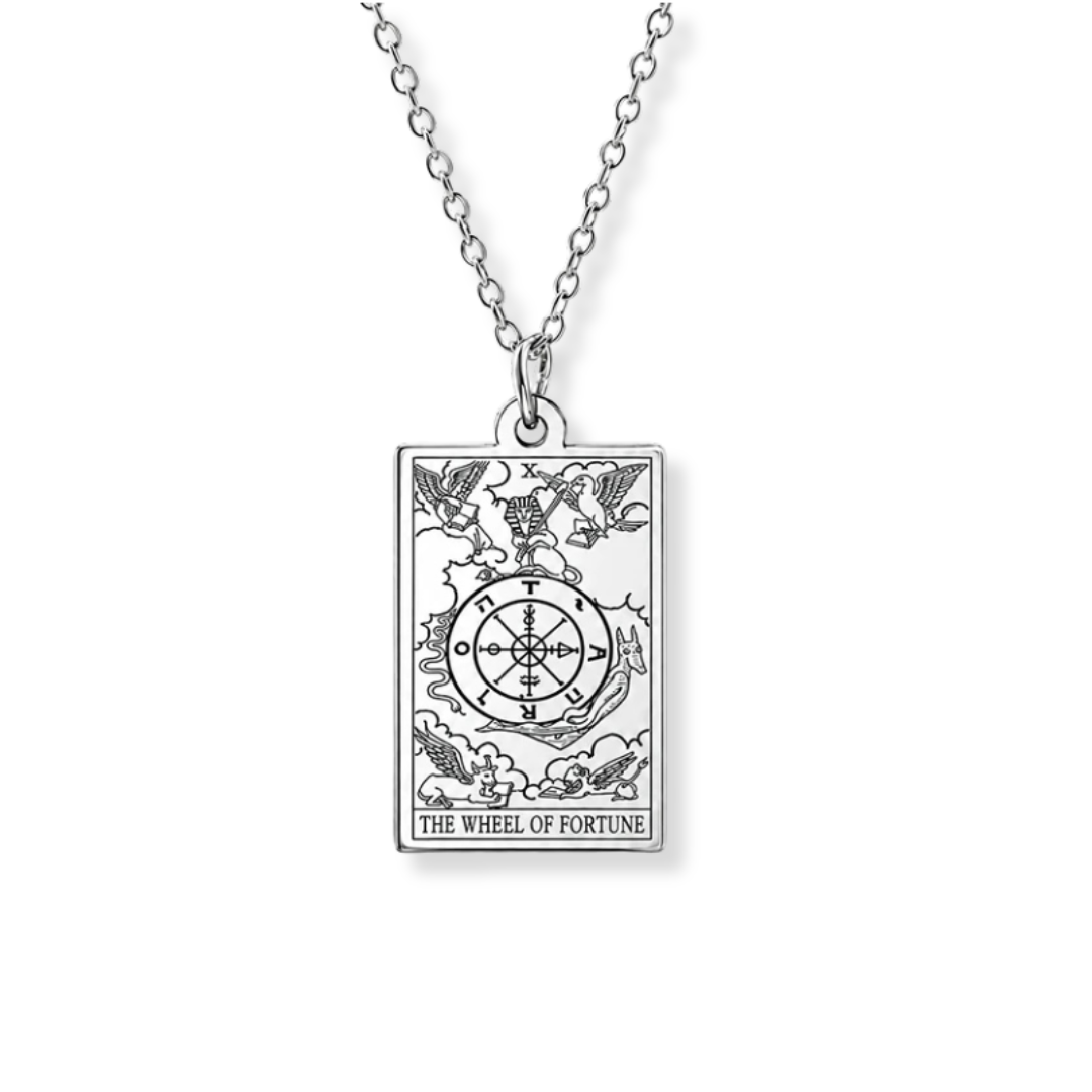 A silver-toned necklace featuring a rectangular pendant engraved with the 'The Wheel of Fortune' tarot card design, suspended from a matching chain against a plain white background.