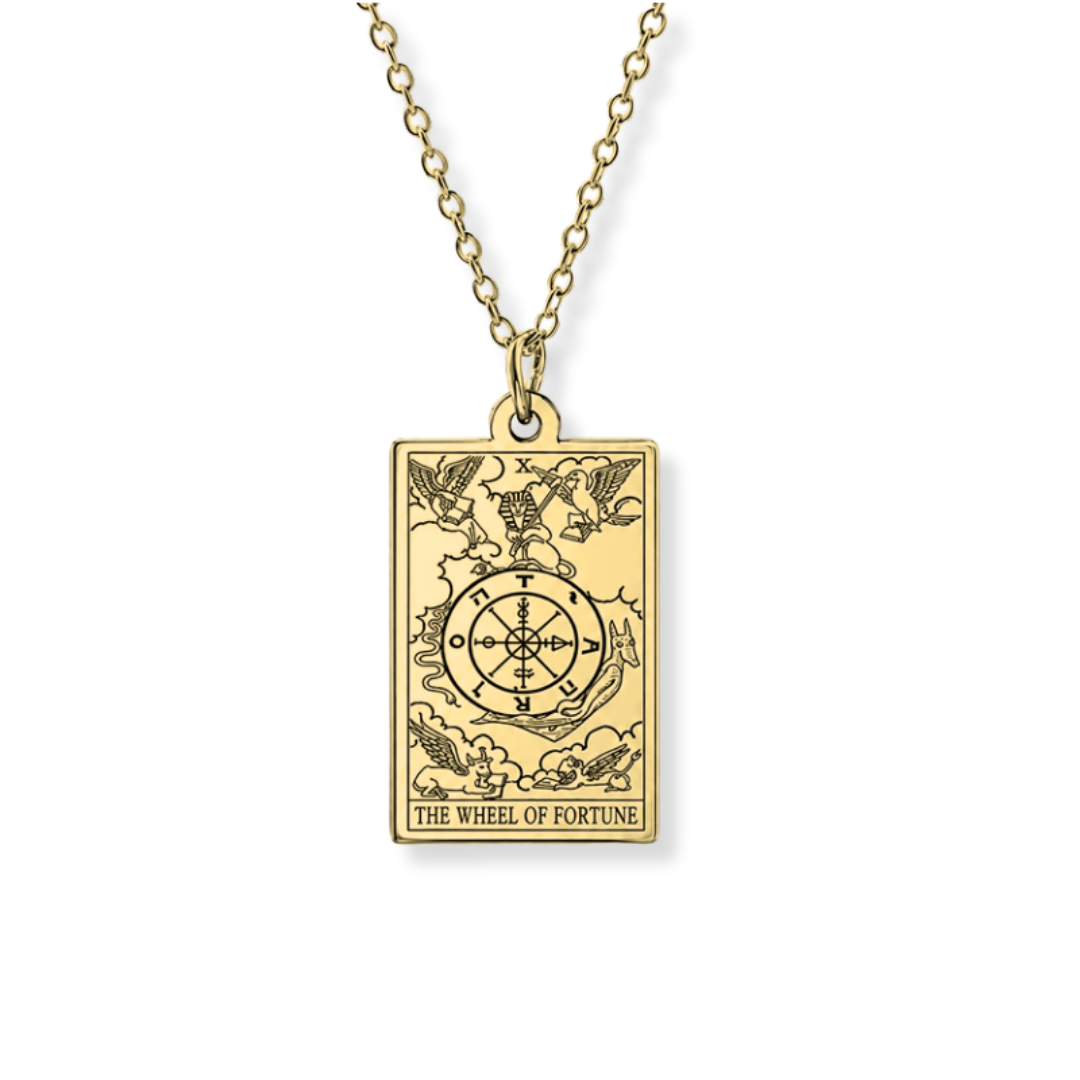 A gold-toned tarot card pendant necklace featuring 'The Wheel of Fortune' card design, suspended from a matching chain against a plain white background.