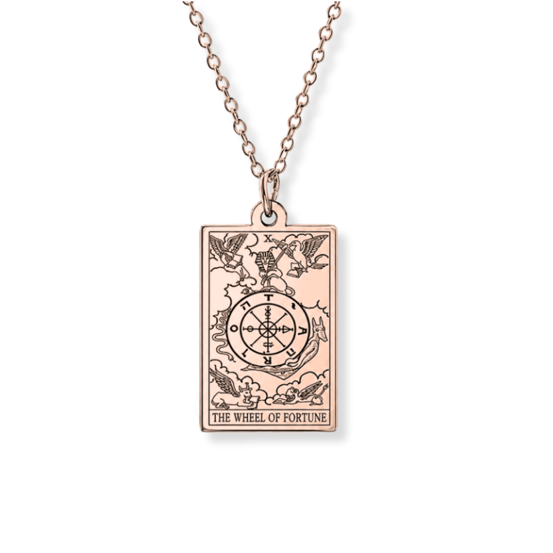 A rose gold rectangular pendant necklace featuring the 'The Wheel of Fortune' tarot card design, suspended from a matching rose gold chain against a plain white background.