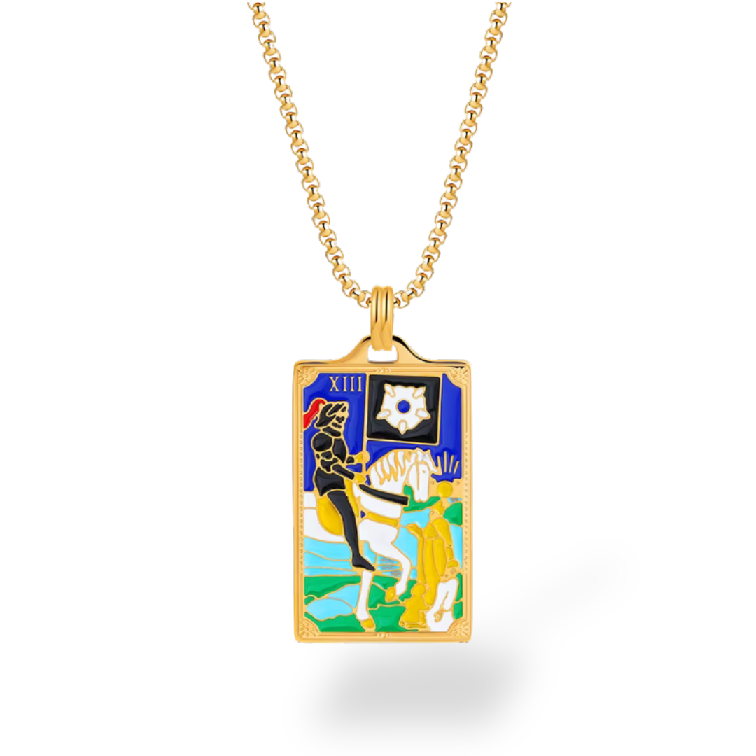 Gold necklace with a tarot card pendant on a white background