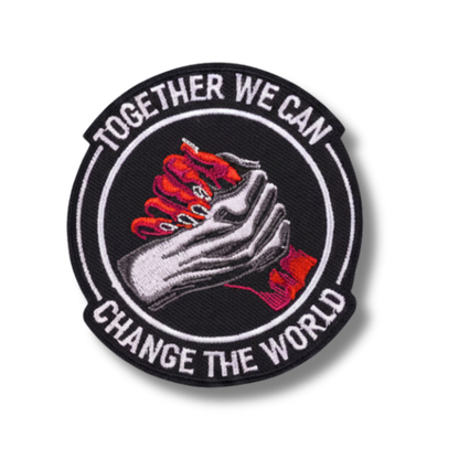 Patch with hands holding a heart and text 'Together we can change the world' on a white background