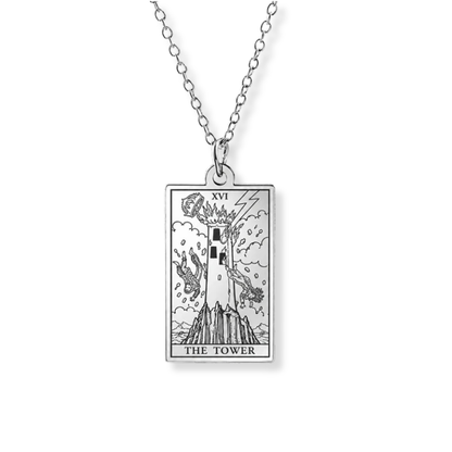 A silver-toned necklace featuring a rectangular pendant with an engraved tarot card design labeled 'THE TOWER' and 'XVI'.