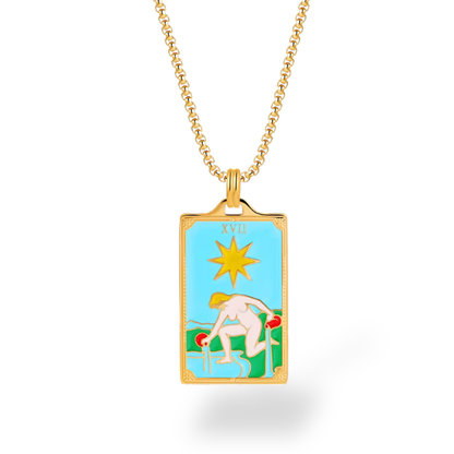 Gold necklace with a rectangular pendant featuring a tarot card design on a white background
