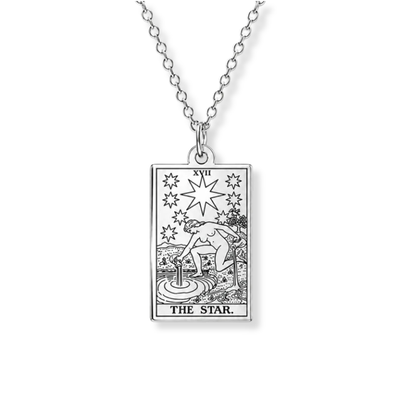 A silver-toned necklace featuring a rectangular pendant engraved with the 'The Star' tarot card design, shown against a plain white background.