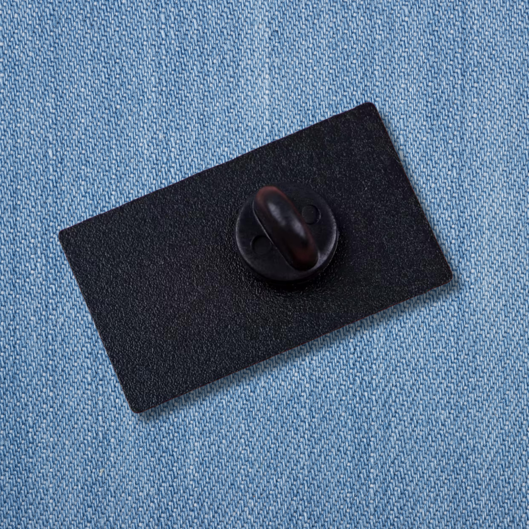 Black backing card with butterfly clasp pin fastener showing the secure closure mechanism and packaging for The Sun tarot card enamel pin