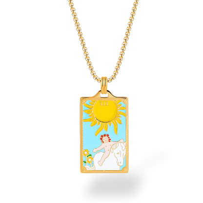 Necklace with a pendant featuring a sun and a person on a horse against a blue sky.