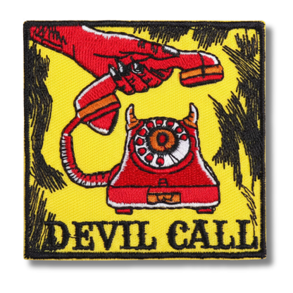 Patch with a red telephone and devil hand design on a yellow background, labeled 'DEVIL CALL'.