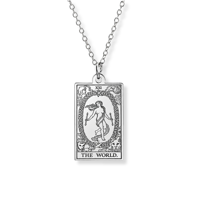 A silver-toned tarot card pendant necklace featuring 'The World' card design, suspended from a matching chain against a plain white background.