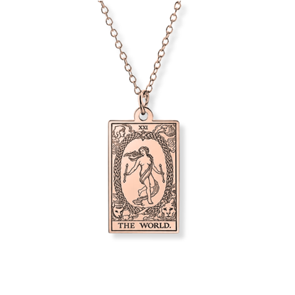 A rose gold tarot card pendant necklace featuring 'The World' card design, suspended from a matching rose gold chain against a plain white background.