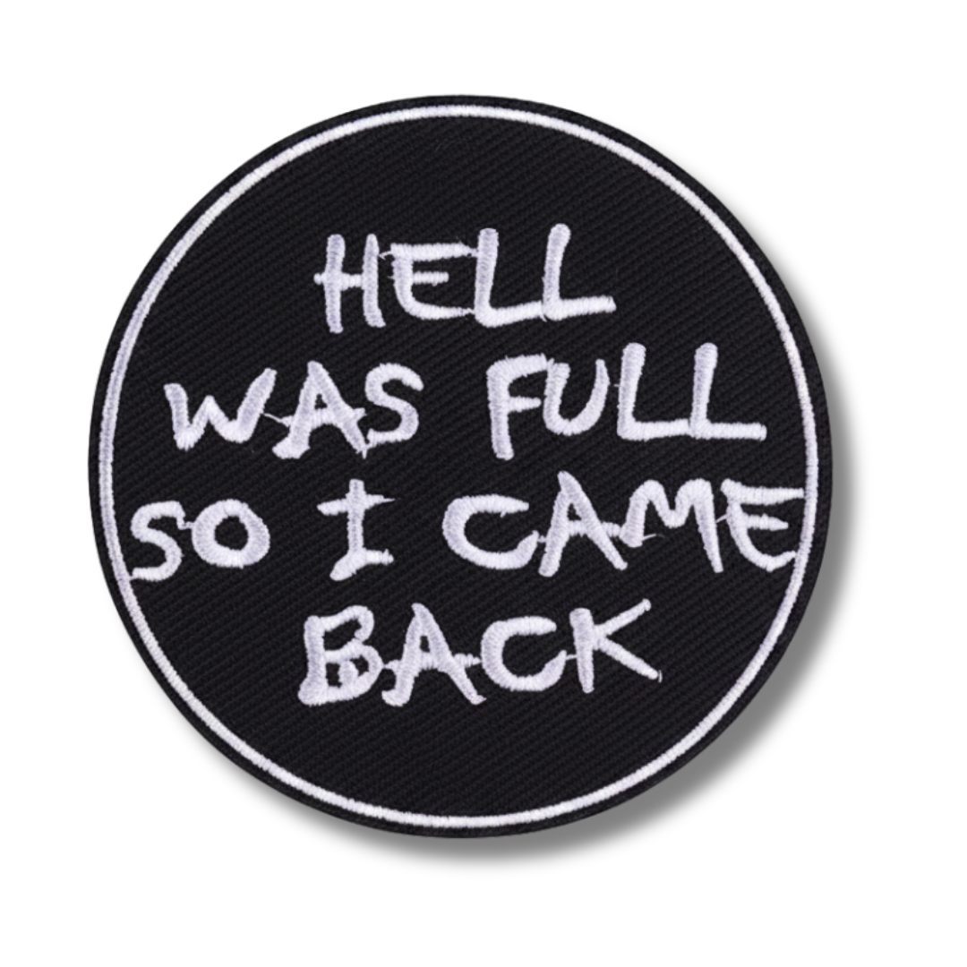 Round black patch with white text 'HELL WAS FULL SO I CAME BACK' on a white background