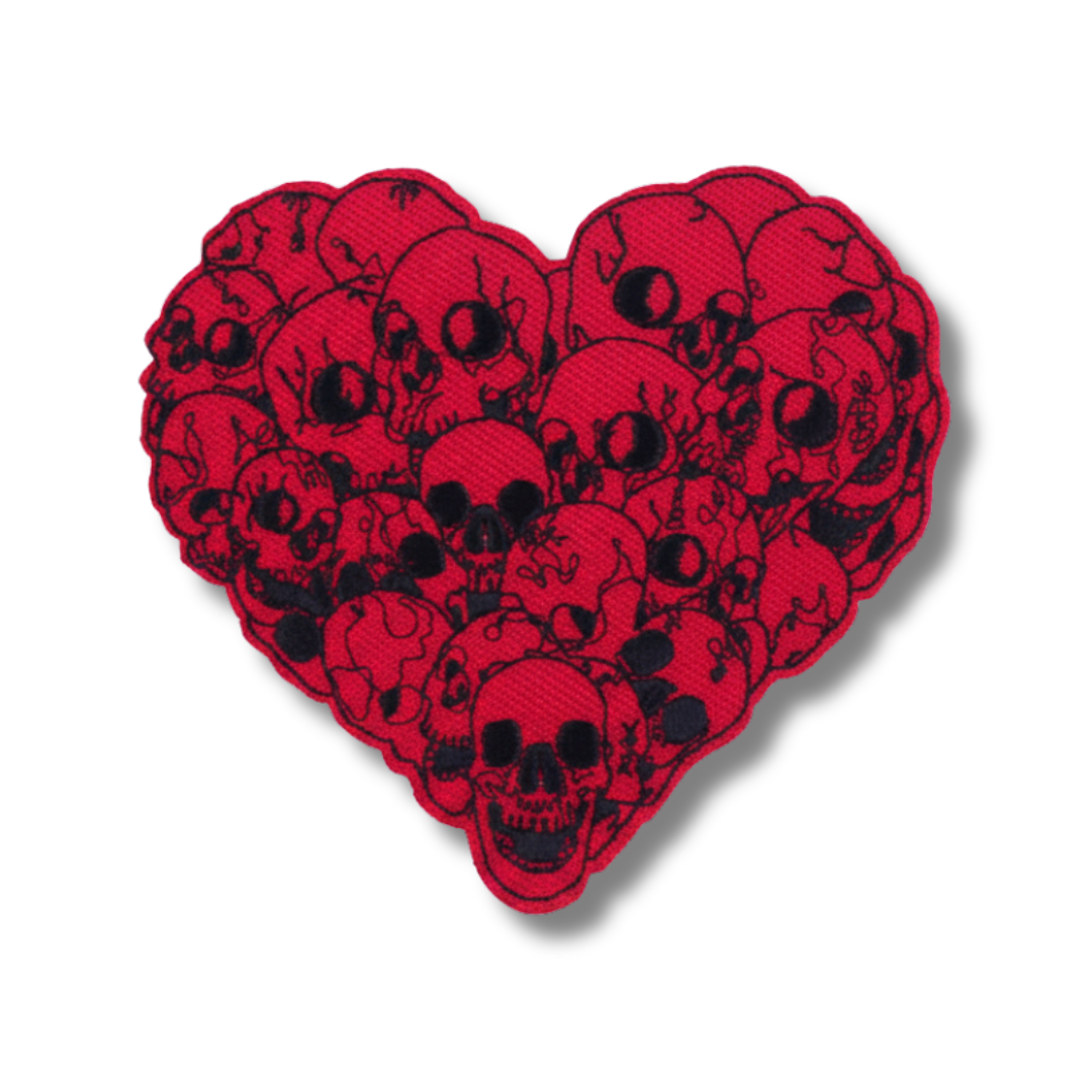Heart-shaped patch with black skull design on a red background