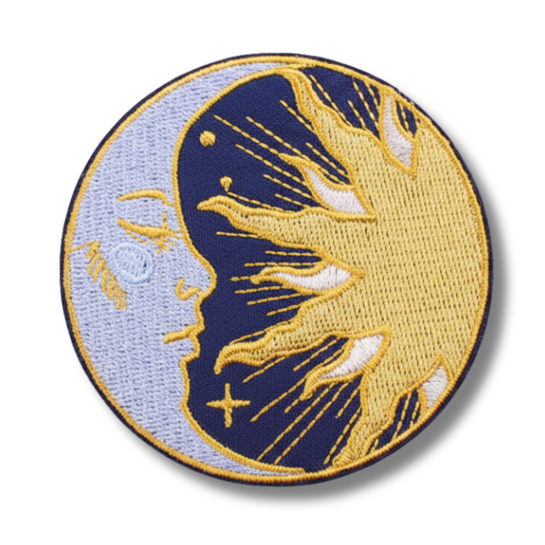 Embroidered patch with a blue and gold design on a white background
