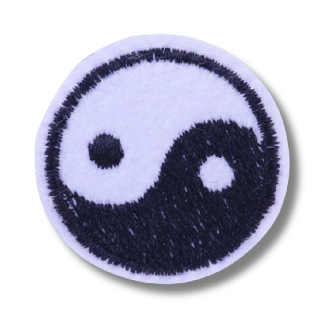 Yin and yang symbol patch on a white background