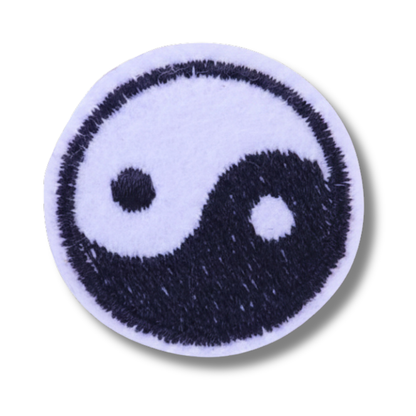 Yin and yang symbol patch on a white background